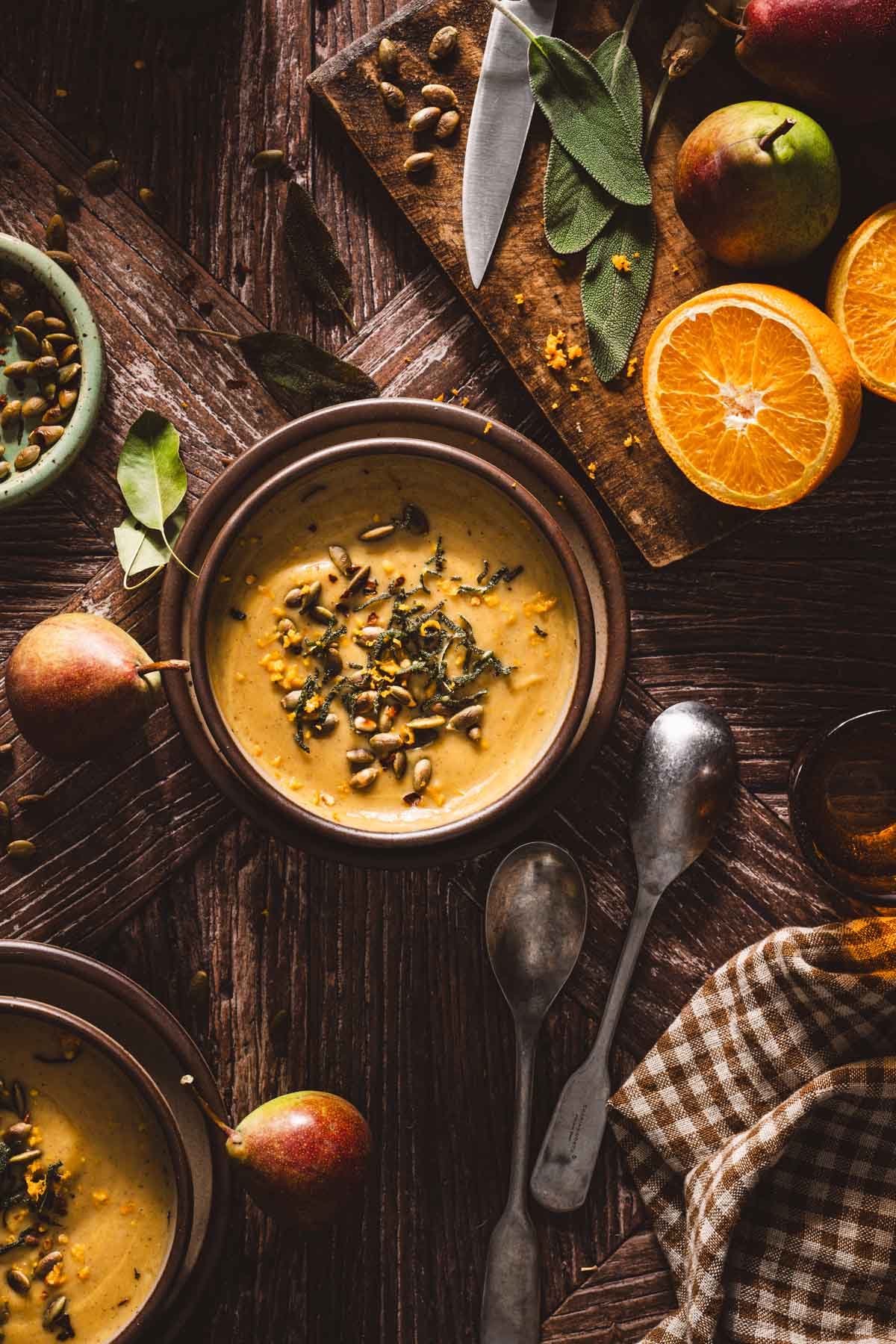 pumpkin soup in a bowlgarnished with fried sage