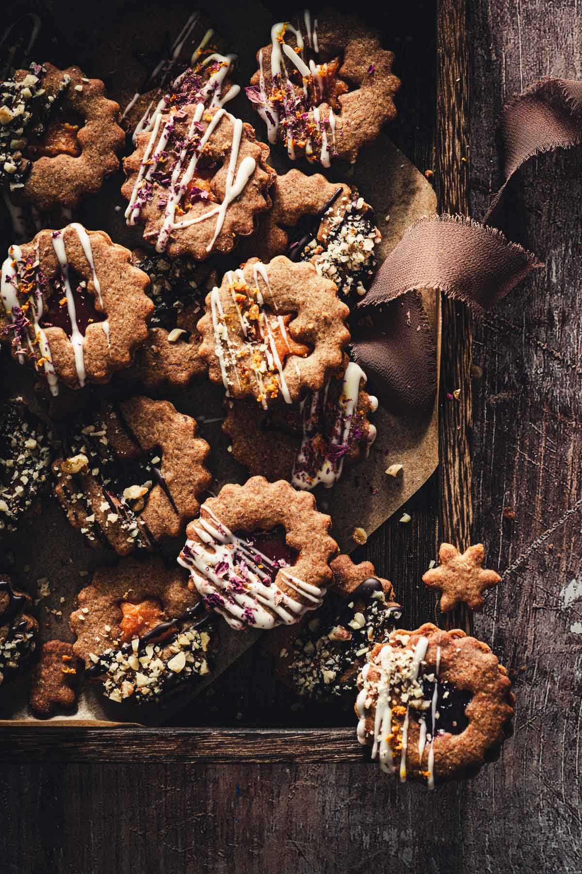 linzer cookies on a wooden tray